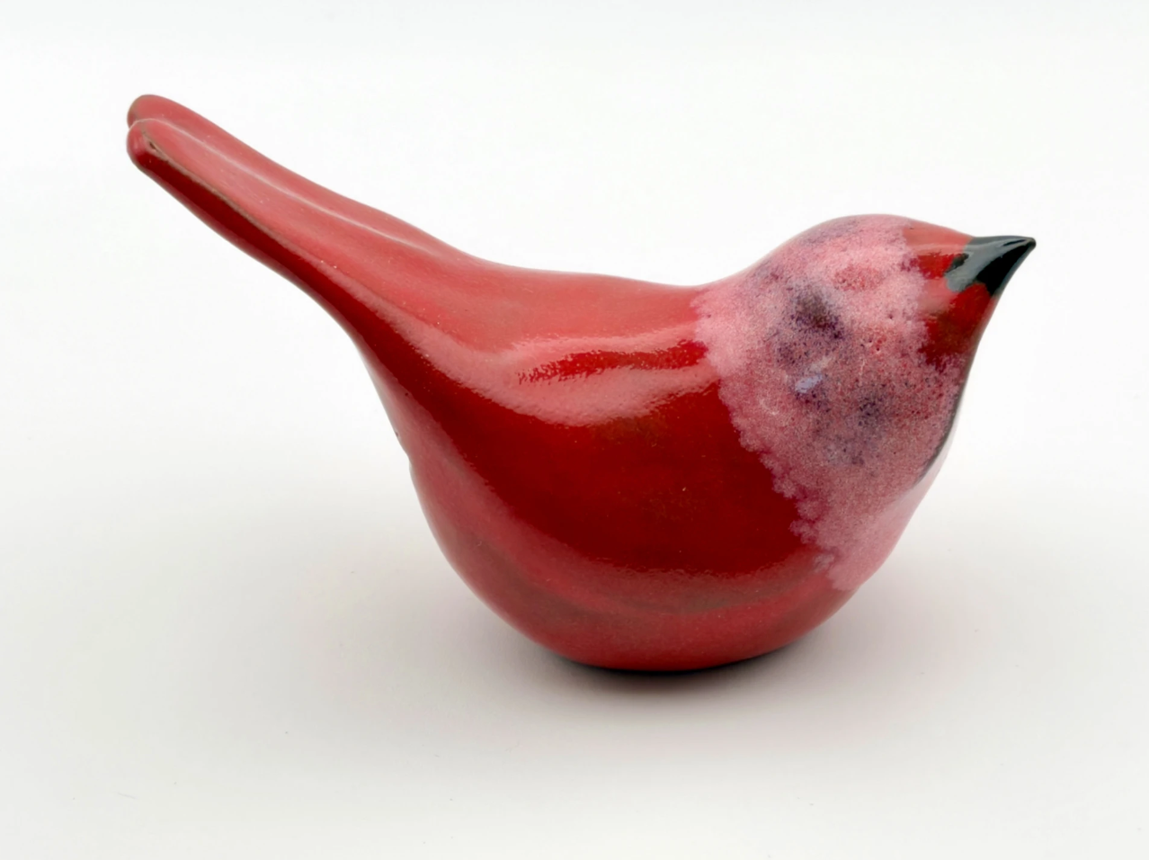 Red ceramic bird sculpture by Janna Carter